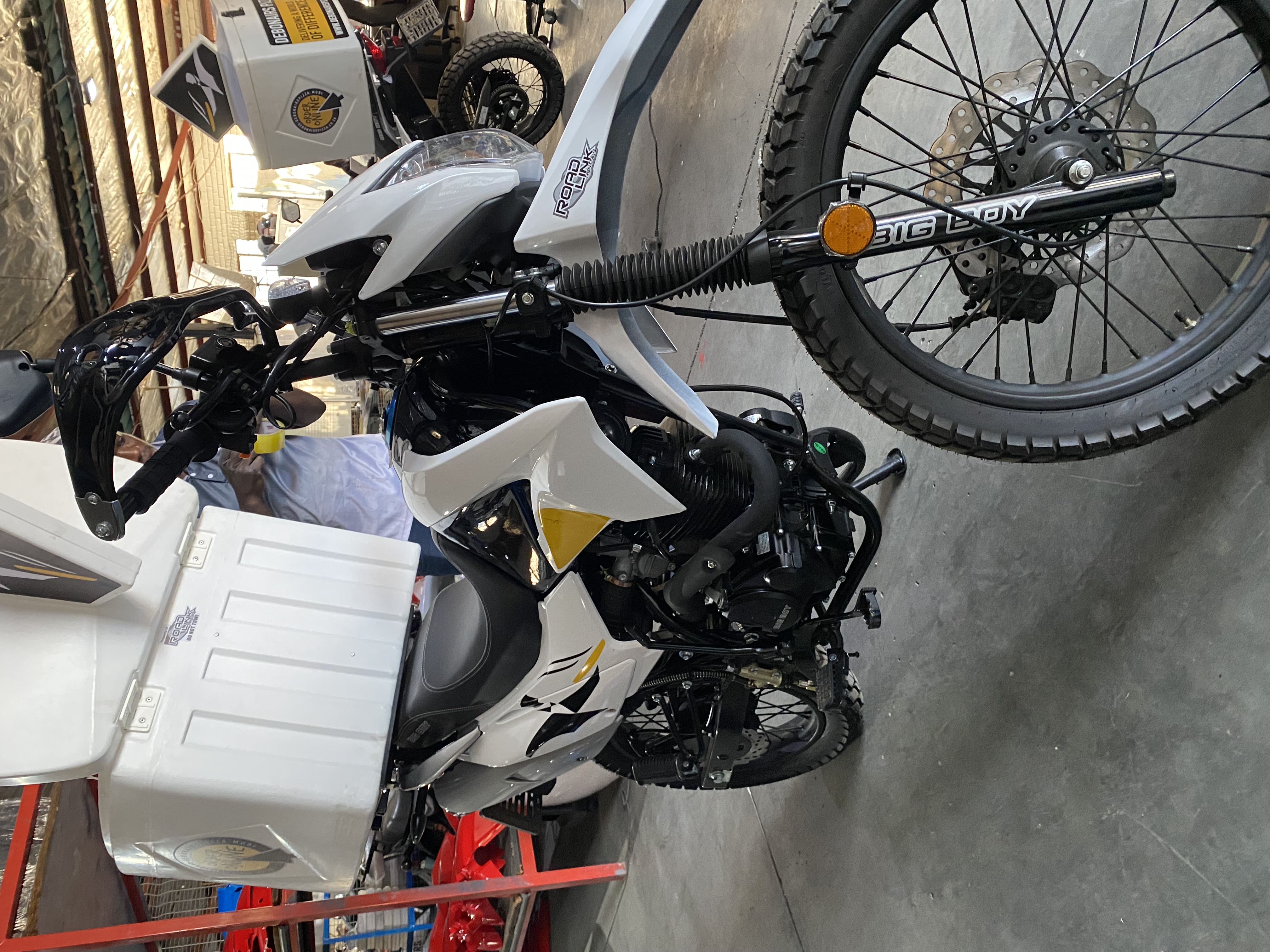 RoadLink workshop technician fitting a motorcycle