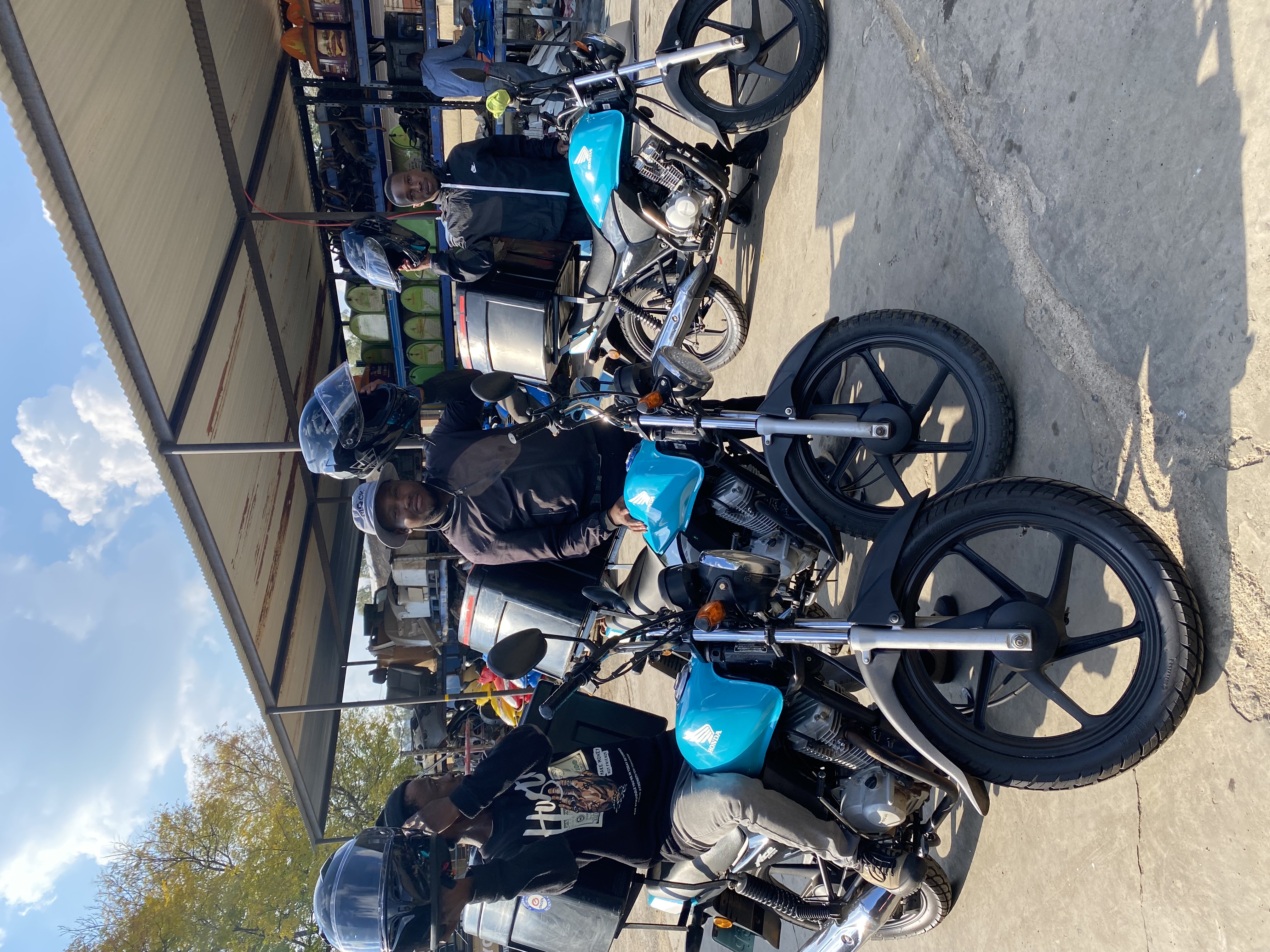 RoadLink riders with their motorcycles